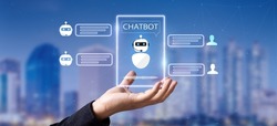 artificial intelligence, AI chat bot concept.Hand holding virtual chat bot assistant on blurred smart city as background