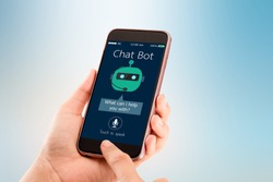 Chat bot concept.Hands holding mobile phone on blurred abstract background