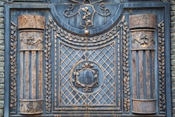 Vintage antique castle gate.  Ancient aged closed, black iron metal door gate