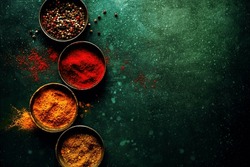 Tasty colorful spices on dark background with copy space. Food concept 