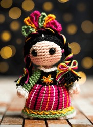 MEXICAN AMIGURUMI WITH LIGHTS IN THE BACKGROUND CONCEP MEXICAN TRADITIONS 