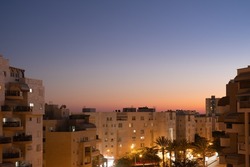 Dramatic dusk evening Israel cityscape Panoramic view from the apartment window to the district in Beersheba.