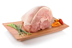 Raw pernil (pernil asado, pernil al horno, roast pork butt). A slow-roasted marinated pork leg or pork shoulder, ready to be cooked. On a cutting board with peppers aside, isolated on white background