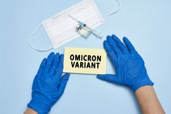 Doctor hand holds a card with text - New covid variant Omicron. Covid-19 new variant - Omicron. Omicron variant of coronavirus. SARS-CoV-2 variant of concern
