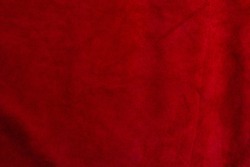 Velvet texture of seamless leather. Felt material macro. Red suede texture. Fabric, leather