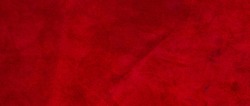 Velvet texture of seamless leather. Felt material macro. Red suede texture.