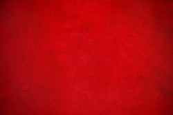 Fabric, leather. Velvet texture of seamless leather. Felt material macro. Red suede texture.
