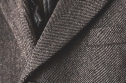 Dark grey tweed coat close up