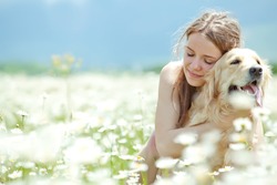 Beautiful woman playing with her ??dog. Outdoor portrait. series