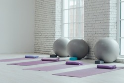 Yoga mats and balls. Yoga accessories, hall, room. High quality photo