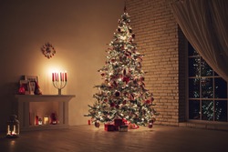 Feast of Christmas. Beautifully decorated house with a Christmas tree ipodarkami underneath