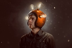 Young man with light bulb helmet