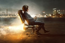 Businessman rolls on office chair with rocket motor