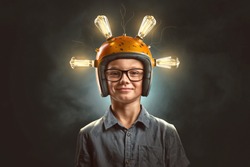 Clever kid with light bulb helmet 
