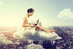 Woman working o a cloud above the city