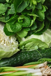 Close up Green vegetables, dark leafy food background. Healthy eating concept of fresh garden produce organically grown.