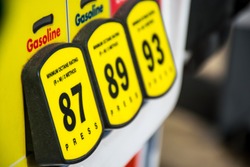 Focused on 87 Octane rating and high prices at the gas pump. Yellow buttons to choose your poison and unleaded or premium gasoline. Fossil fuels power our cars and transportation and cost is rising