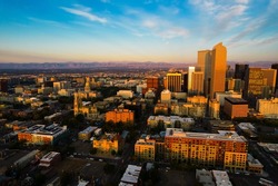 sunrise over Denver Colorado USA gorgeous golden hour sunlight hits skyline cityscape of the mile high city 