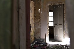 Decaying door to a room inside Whittingham Mental Asylum, the largest abandoned hospital in Europe