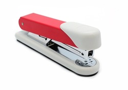 A closeup of a manual office stapler on the white background.