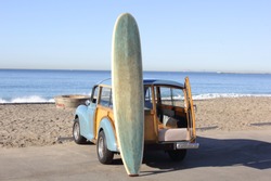 Woody at the Beach in Southern California with Surfboard
