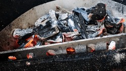 Smoke from starting a fire, Make a fire with charcoal, light up the coals. prepare a grill         
