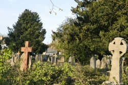 Gothic headstones in graveyard, concrete tomb stones of graves in church yard cemetery