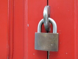 Close up Red wooden door with padlock