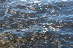 Trash in sea water. Plastic bags in ocean. Ecological problem. Urban seaside pollution. Human activity influence to wild life and natural environment. Garbage in seawater. Marine pollution in Asia