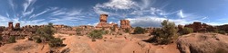 A panoramic view of canyonland red rock rim shows the canyons, rim and high wind blown wispy clouds, Canyonlands National Park, San Juan County, Utah