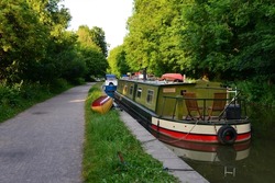 Scenic view of narrow boats on the Kennet and Avon Canal in Wiltshire England