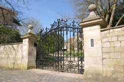 View of an Ornate Gated Entrance of an Old English Country House Driveway
