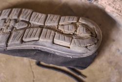 Closeup of broken flip flops, flip-flops , flipflops, slippers, blue slippers, blue flipflops, broken,  torn, ripped, sandal, chappal, tooti hui chappal, broken shoe sole, footwear, isolated, shoe 