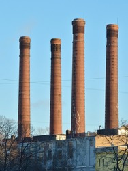 The production landscape.Tall chimneys of brick of the local plant.