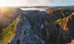 Russia, Republic Of Dagestan. Chirkeyskaya HPP at dawn in the spring. Hydroelectric power station on the Sulak river near the village of Dubki. Panoramic view.