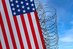 national flag of USA on concrete wall, barbed wire fence, concept of prison, symbol of police state, territory border, totalitarian regime, restriction of rights and freedoms of citizens