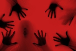 eerie blurry hands of people as if they have been trapped behind glass, dense fabric, wrap, ghost, spirit trying to reach out from afterlife, concept of violence, nightmares, halloween horror