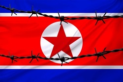 national flag of north korea on textured background, rows of barbed wire, concept of war, revolution, armed uprising in country, increase in crime in state, terrorist attack, redistribution of power