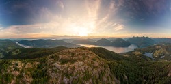 Beautiful Aerial Panoramic View of Canadian Nature Landscape from the top of Tin Hat Mountain during a sunny summer sunset. Taken near Powell River, Sunshine Coast, British Columbia, Canada.
