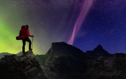 Girl Hiking on top of Rocky Mountains with backpack. Dreamscape Adventure Composite. Night Sky with Stars and Aurora Northern Lights. Concept: Freedom, Explore, Travel, Fitness
