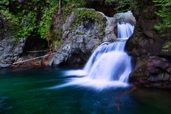 Beautiful Waterfalls in Lynn Valley Canyons, North Vancouver, British Columbia, Canada. Colorful Artistic Render