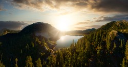 Aerial Panoramic View of Beautiful Glacier Lake in the Canadian Mountain Landscape. Dramatic Colorful Sunset Art Render. Whistler, British Columbia, Canada. Nature Background Panorama