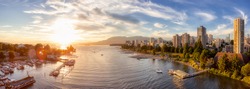 Aerial Panoramic View of Modern City with a beach on the West Coast Pacific Ocean. Sunny Summer Sunset. False Creek, Downtown Vancouver, British Columbia, Canada.