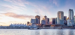 Panoramic View of Modern City Building Skyline on West Coast Pacific Ocean. Dramatic Sunrise Sky Art Render. Stanley Park, Coal Harbour, Downtown Vancouver, British Columbia, Canada.