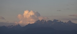 Rocky Mountain Landscape with puffy clouds during sunset. Greater Vancouver, British Columbia, Canada. Nature Background.