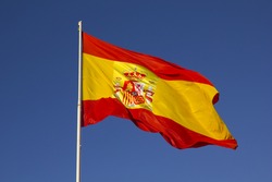 Spanish flag on a pole, undulating in the wind