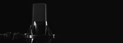 Professional studio microphone isolated on black background with copy space