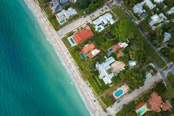 View from above of large residential houses in island small town Boca Grande on Gasparilla Island in southwest Florida. American dream homes as example of real estate development in US suburbs