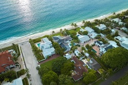 Aerial view of expensive residential houses in island small town Boca Grande on Gasparilla Island in southwest Florida. American dream homes as example of real estate development in US suburbs