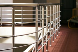 Shiny chrome metal fencing and railings in a hotel interior